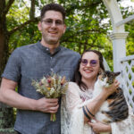 couple holding a pet cat