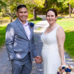 groom and bride holding hands